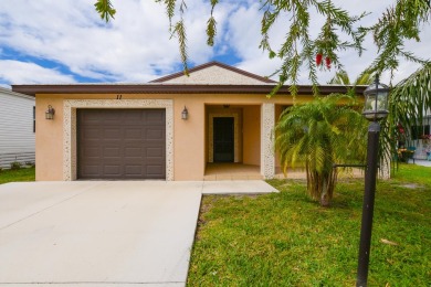 Very solid concrete block home with metal roof and accordion on Spanish Lakes I in Florida - for sale on GolfHomes.com, golf home, golf lot