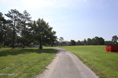 1.02-acre wooded lot in Boiling Spring Lakes, offering a on The Lakes Country Club in North Carolina - for sale on GolfHomes.com, golf home, golf lot
