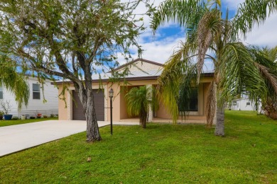 Very solid concrete block home with metal roof and accordion on Spanish Lakes I in Florida - for sale on GolfHomes.com, golf home, golf lot