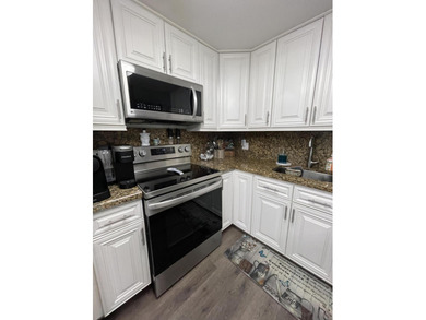 YOU WILL LOVE THIS PLACE! Cozy, clean, and modern condo in on Hillsboro Pines Golf in Florida - for sale on GolfHomes.com, golf home, golf lot