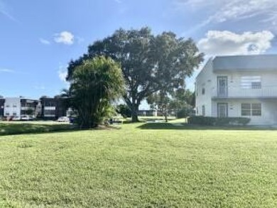 Great Location! True 1st floor with fabulous canal view on side on Kings Point Golf -Flanders Way in Florida - for sale on GolfHomes.com, golf home, golf lot