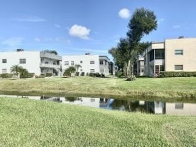 Great Location! True 1st floor with fabulous canal view on side on Kings Point Golf -Flanders Way in Florida - for sale on GolfHomes.com, golf home, golf lot