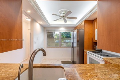 Welcome to this charming 2-bedroom, 2-bathroom condominium on Wynmoor Golf Course in Florida - for sale on GolfHomes.com, golf home, golf lot