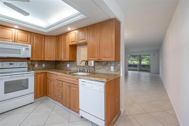 Welcome to this charming 2-bedroom, 2-bathroom condominium on Wynmoor Golf Course in Florida - for sale on GolfHomes.com, golf home, golf lot