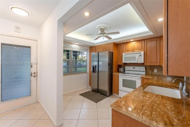 Welcome to this charming 2-bedroom, 2-bathroom condominium on Wynmoor Golf Course in Florida - for sale on GolfHomes.com, golf home, golf lot