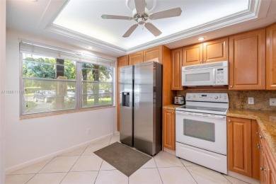 Welcome to this charming 2-bedroom, 2-bathroom condominium on Wynmoor Golf Course in Florida - for sale on GolfHomes.com, golf home, golf lot