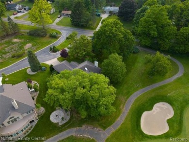 Welcome to 2692 Mulligan, a serene retreat nestled along Hole 7 on Country Club of Jackson in Michigan - for sale on GolfHomes.com, golf home, golf lot
