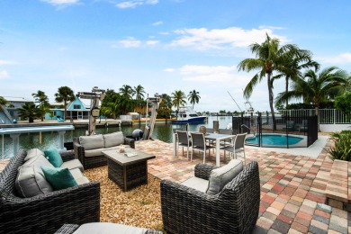 This Key Colony Beach coastal retreat blends modern elegance on Key Colony Beach Golf Course in Florida - for sale on GolfHomes.com, golf home, golf lot