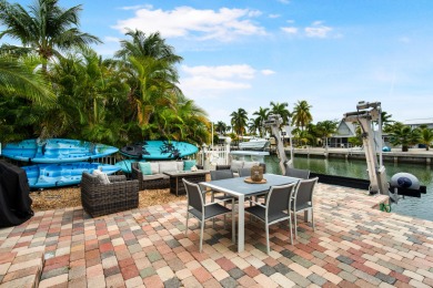 This Key Colony Beach coastal retreat blends modern elegance on Key Colony Beach Golf Course in Florida - for sale on GolfHomes.com, golf home, golf lot
