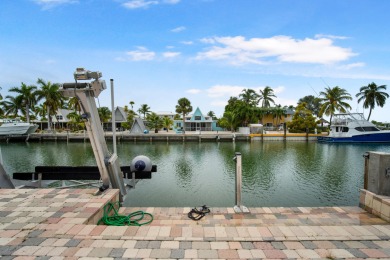 This Key Colony Beach coastal retreat blends modern elegance on Key Colony Beach Golf Course in Florida - for sale on GolfHomes.com, golf home, golf lot