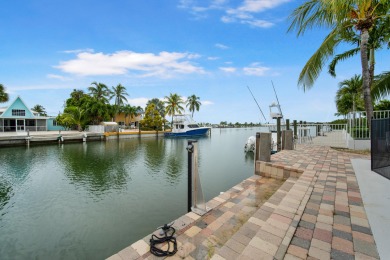 This Key Colony Beach coastal retreat blends modern elegance on Key Colony Beach Golf Course in Florida - for sale on GolfHomes.com, golf home, golf lot