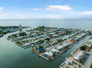 This Key Colony Beach coastal retreat blends modern elegance on Key Colony Beach Golf Course in Florida - for sale on GolfHomes.com, golf home, golf lot