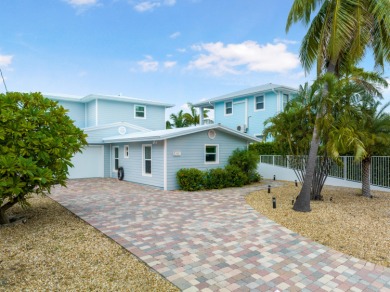 This Key Colony Beach coastal retreat blends modern elegance on Key Colony Beach Golf Course in Florida - for sale on GolfHomes.com, golf home, golf lot
