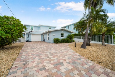 This Key Colony Beach coastal retreat blends modern elegance on Key Colony Beach Golf Course in Florida - for sale on GolfHomes.com, golf home, golf lot