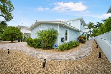 This Key Colony Beach coastal retreat blends modern elegance on Key Colony Beach Golf Course in Florida - for sale on GolfHomes.com, golf home, golf lot