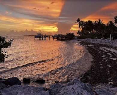 This Key Colony Beach coastal retreat blends modern elegance on Key Colony Beach Golf Course in Florida - for sale on GolfHomes.com, golf home, golf lot
