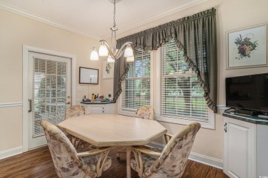 Elegance meets timeless Southern charm in this exquisite on Pawleys Plantation Golf and Country Club in South Carolina - for sale on GolfHomes.com, golf home, golf lot