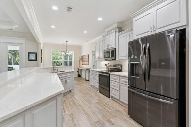 Situated on over an acre in the prestigious Sanctuary Cove on The Golf Club At Sanctuary Cove in Georgia - for sale on GolfHomes.com, golf home, golf lot