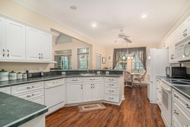 Elegance meets timeless Southern charm in this exquisite on Pawleys Plantation Golf and Country Club in South Carolina - for sale on GolfHomes.com, golf home, golf lot