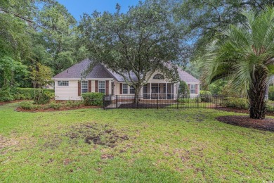 Elegance meets timeless Southern charm in this exquisite on Pawleys Plantation Golf and Country Club in South Carolina - for sale on GolfHomes.com, golf home, golf lot