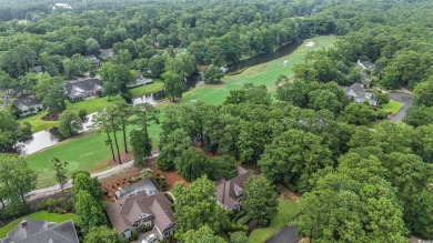 Elegance meets timeless Southern charm in this exquisite on Pawleys Plantation Golf and Country Club in South Carolina - for sale on GolfHomes.com, golf home, golf lot