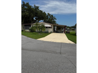 This well-maintained 2-bedroom, 2-bath home offers 1,255 sq. ft on Golden Lakes Golf Course in Florida - for sale on GolfHomes.com, golf home, golf lot