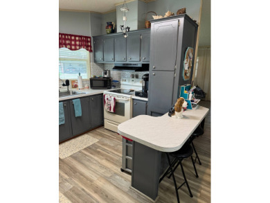 This well-maintained 2-bedroom, 2-bath home offers 1,255 sq. ft on Golden Lakes Golf Course in Florida - for sale on GolfHomes.com, golf home, golf lot