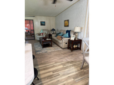 This well-maintained 2-bedroom, 2-bath home offers 1,255 sq. ft on Golden Lakes Golf Course in Florida - for sale on GolfHomes.com, golf home, golf lot
