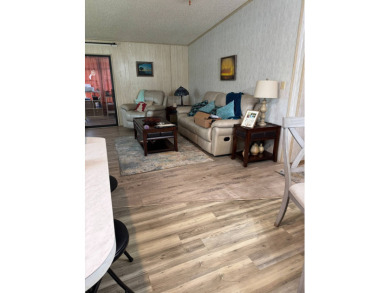 This well-maintained 2-bedroom, 2-bath home offers 1,255 sq. ft on Golden Lakes Golf Course in Florida - for sale on GolfHomes.com, golf home, golf lot