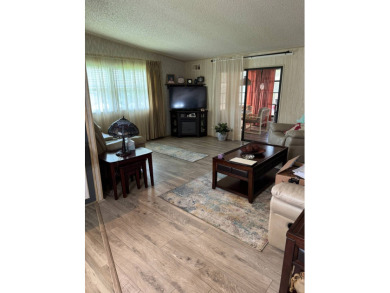 This well-maintained 2-bedroom, 2-bath home offers 1,255 sq. ft on Golden Lakes Golf Course in Florida - for sale on GolfHomes.com, golf home, golf lot