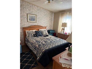 This well-maintained 2-bedroom, 2-bath home offers 1,255 sq. ft on Golden Lakes Golf Course in Florida - for sale on GolfHomes.com, golf home, golf lot