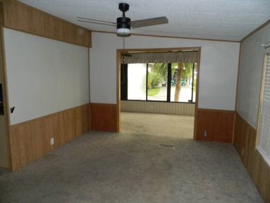 Lovely oasis in backyard, this 1,467 sq ft home on a perimeter on Grasslands Golf and Country Club in Florida - for sale on GolfHomes.com, golf home, golf lot