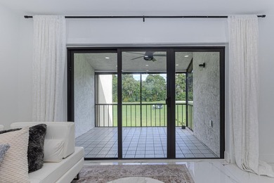 Stunning second-story condo in the prestigious Boca Lago Golf & on Boca Lago Golf and Country Club in Florida - for sale on GolfHomes.com, golf home, golf lot