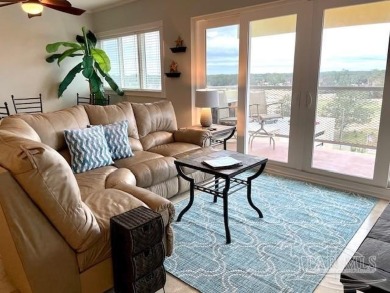 This beautifully furnished, wheelchair-accessible corner unit on on Pensacola Country Club in Florida - for sale on GolfHomes.com, golf home, golf lot