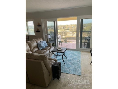 This beautifully furnished, wheelchair-accessible corner unit on on Pensacola Country Club in Florida - for sale on GolfHomes.com, golf home, golf lot