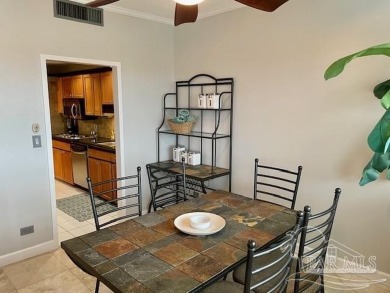 This beautifully furnished, wheelchair-accessible corner unit on on Pensacola Country Club in Florida - for sale on GolfHomes.com, golf home, golf lot