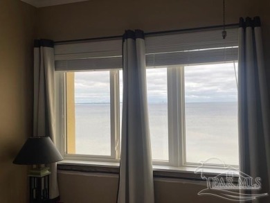 This beautifully furnished, wheelchair-accessible corner unit on on Pensacola Country Club in Florida - for sale on GolfHomes.com, golf home, golf lot