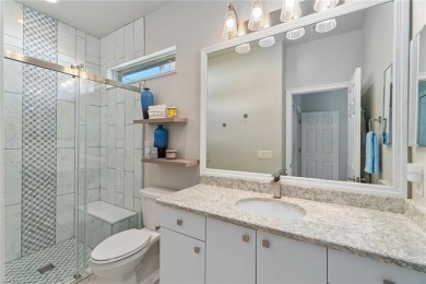Live the indoor-outdoor lifestyle in this beautifully updated on Gateway Golf and Country Club in Florida - for sale on GolfHomes.com, golf home, golf lot