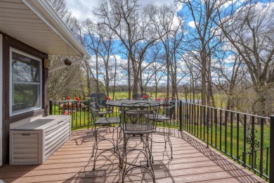 This fantastic home overlooks the 14th green of Lake Cora Hills on Lake Cora Hills Golf Club in Michigan - for sale on GolfHomes.com, golf home, golf lot