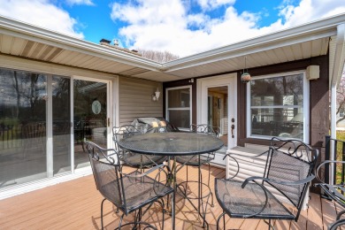 This fantastic home overlooks the 14th green of Lake Cora Hills on Lake Cora Hills Golf Club in Michigan - for sale on GolfHomes.com, golf home, golf lot