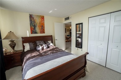 Welcome to this immaculate 2-bedroom, 2-bathroom condo on the on Pembroke Lakes Golf Club in Florida - for sale on GolfHomes.com, golf home, golf lot