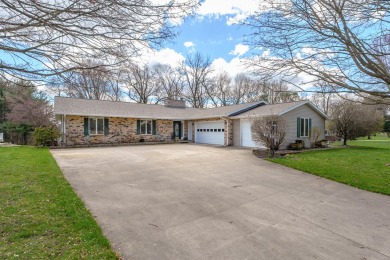 This fantastic home overlooks the 14th green of Lake Cora Hills on Lake Cora Hills Golf Club in Michigan - for sale on GolfHomes.com, golf home, golf lot