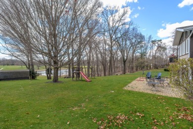 This fantastic home overlooks the 14th green of Lake Cora Hills on Lake Cora Hills Golf Club in Michigan - for sale on GolfHomes.com, golf home, golf lot