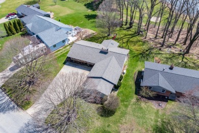 This fantastic home overlooks the 14th green of Lake Cora Hills on Lake Cora Hills Golf Club in Michigan - for sale on GolfHomes.com, golf home, golf lot