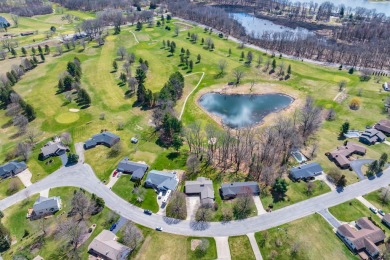 This fantastic home overlooks the 14th green of Lake Cora Hills on Lake Cora Hills Golf Club in Michigan - for sale on GolfHomes.com, golf home, golf lot