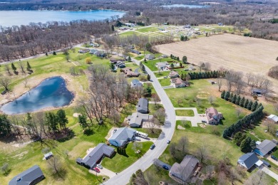 This fantastic home overlooks the 14th green of Lake Cora Hills on Lake Cora Hills Golf Club in Michigan - for sale on GolfHomes.com, golf home, golf lot