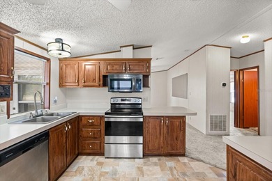 WHITE WALLS IN KITCHEN AND BEDROOM COMING SOON. PICTURES ARE on Zellwood Station Country Club in Florida - for sale on GolfHomes.com, golf home, golf lot