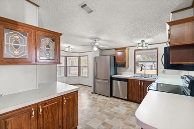 WHITE WALLS IN KITCHEN AND BEDROOM COMING SOON. PICTURES ARE on Zellwood Station Country Club in Florida - for sale on GolfHomes.com, golf home, golf lot