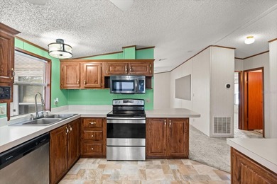 WHITE WALLS IN KITCHEN AND BEDROOM COMING SOON. PICTURES ARE on Zellwood Station Country Club in Florida - for sale on GolfHomes.com, golf home, golf lot