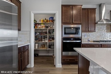 Set against the scenic backdrop of a manicured golf course, this on Conestoga Golf Club in Nevada - for sale on GolfHomes.com, golf home, golf lot